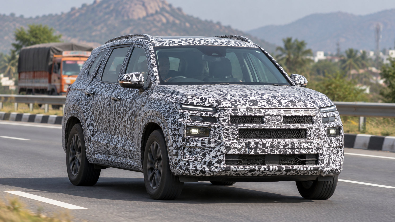 Camouflaged SUV prototype being tested on an Indian road